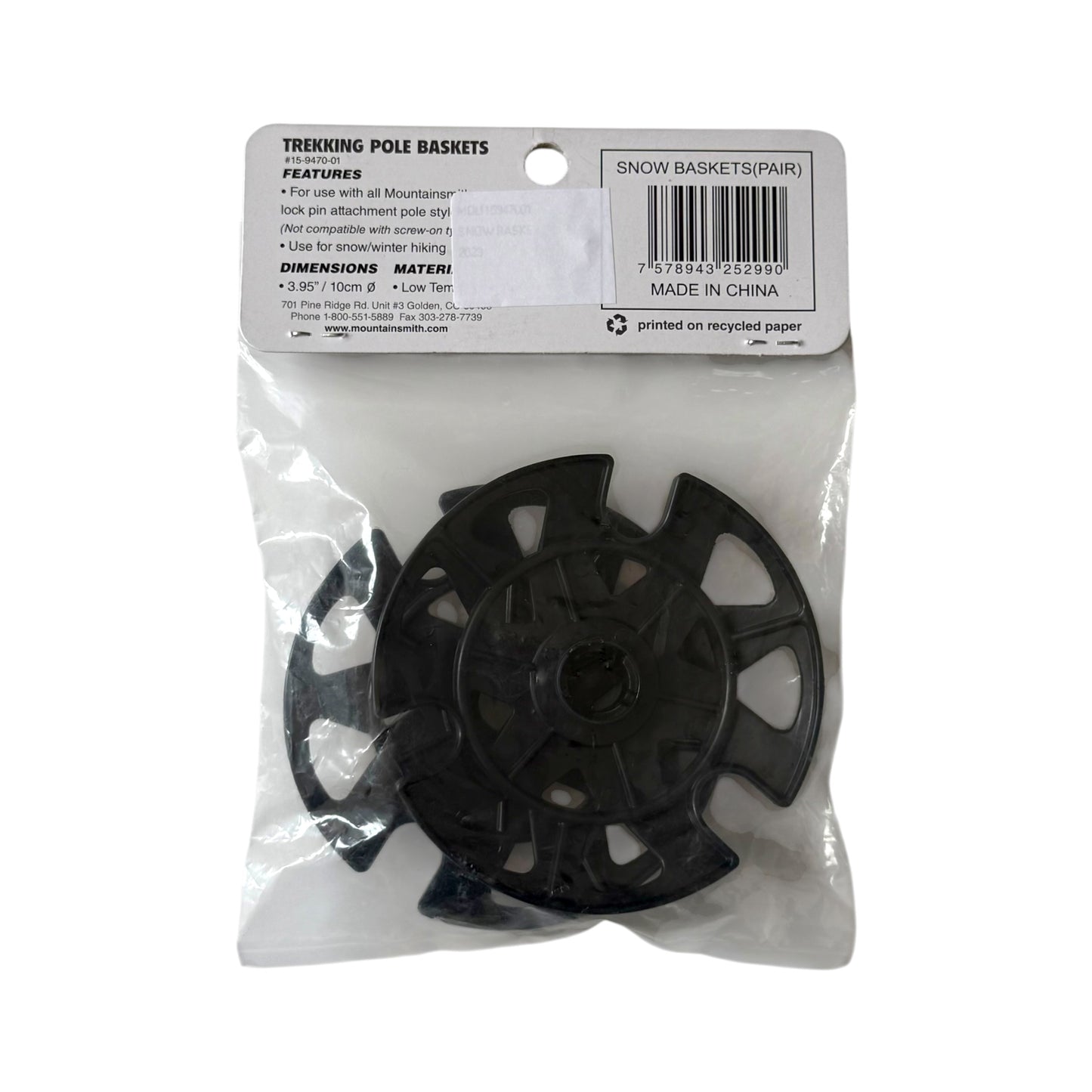 A pair of black plastic treking pole baskets packaged in a clear plastic bag with a white paper header card. The header card features text including 'TREKING POLE BASKETS', 'SNOW BASKETS PARK', dimensions, and a barcode.