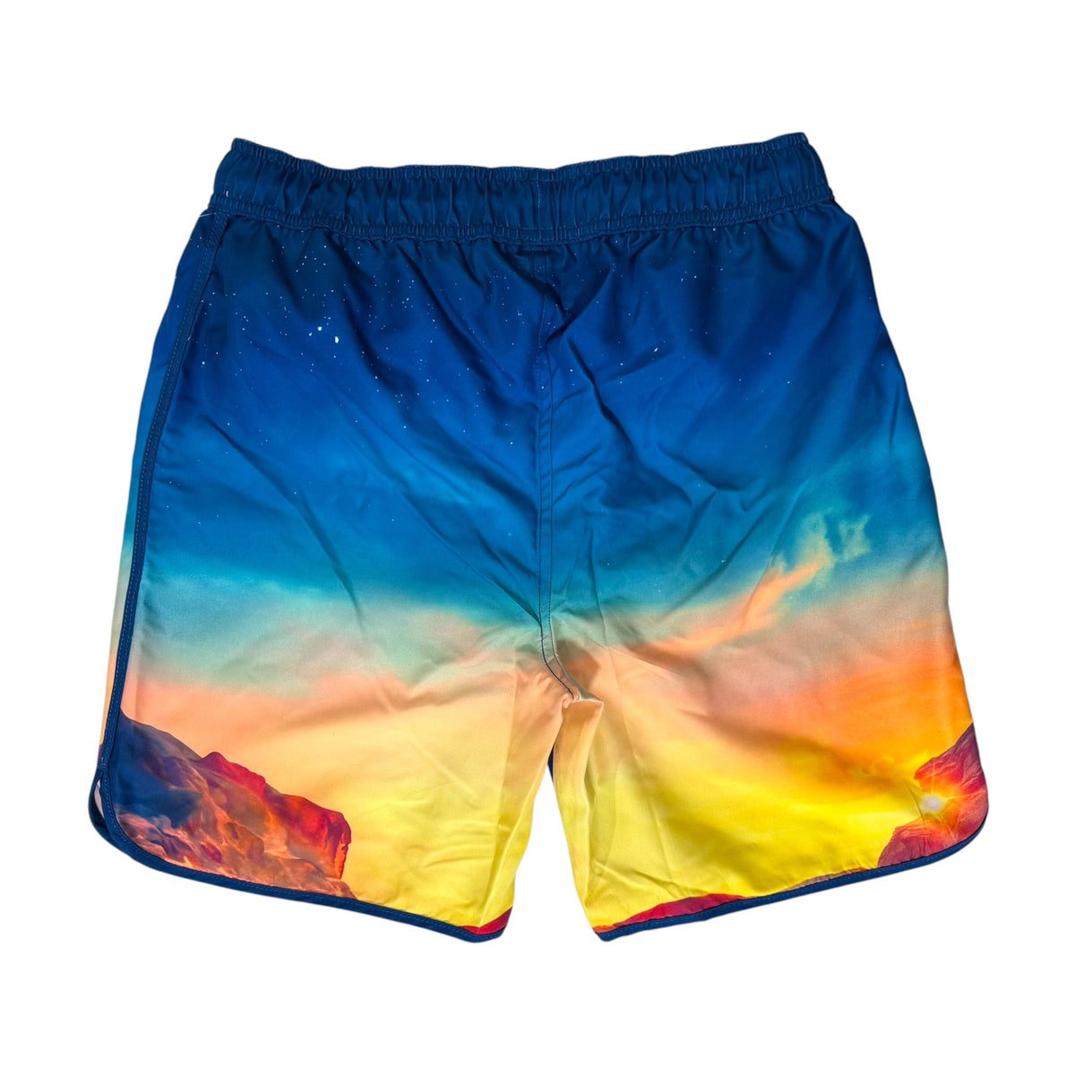 A pair of Star Wars: The Mandalorian Men's Swim Shorts shown on a white background