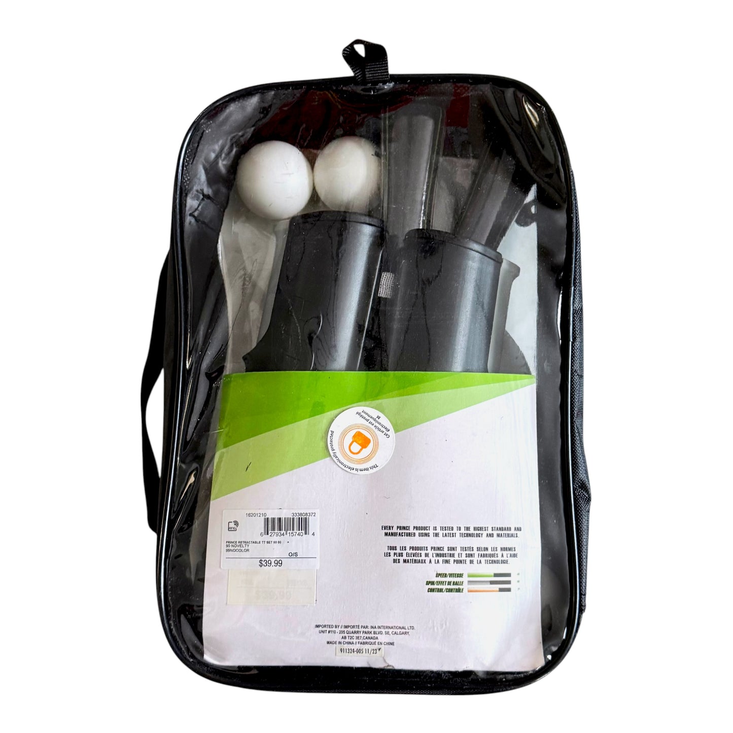 Prince retractable racket set in a clear zippered carrying case, showing a red racket, black paddles, and white balls inside.