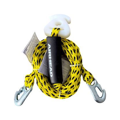 A coiled yellow and black tow harness, shown on a plain white background.