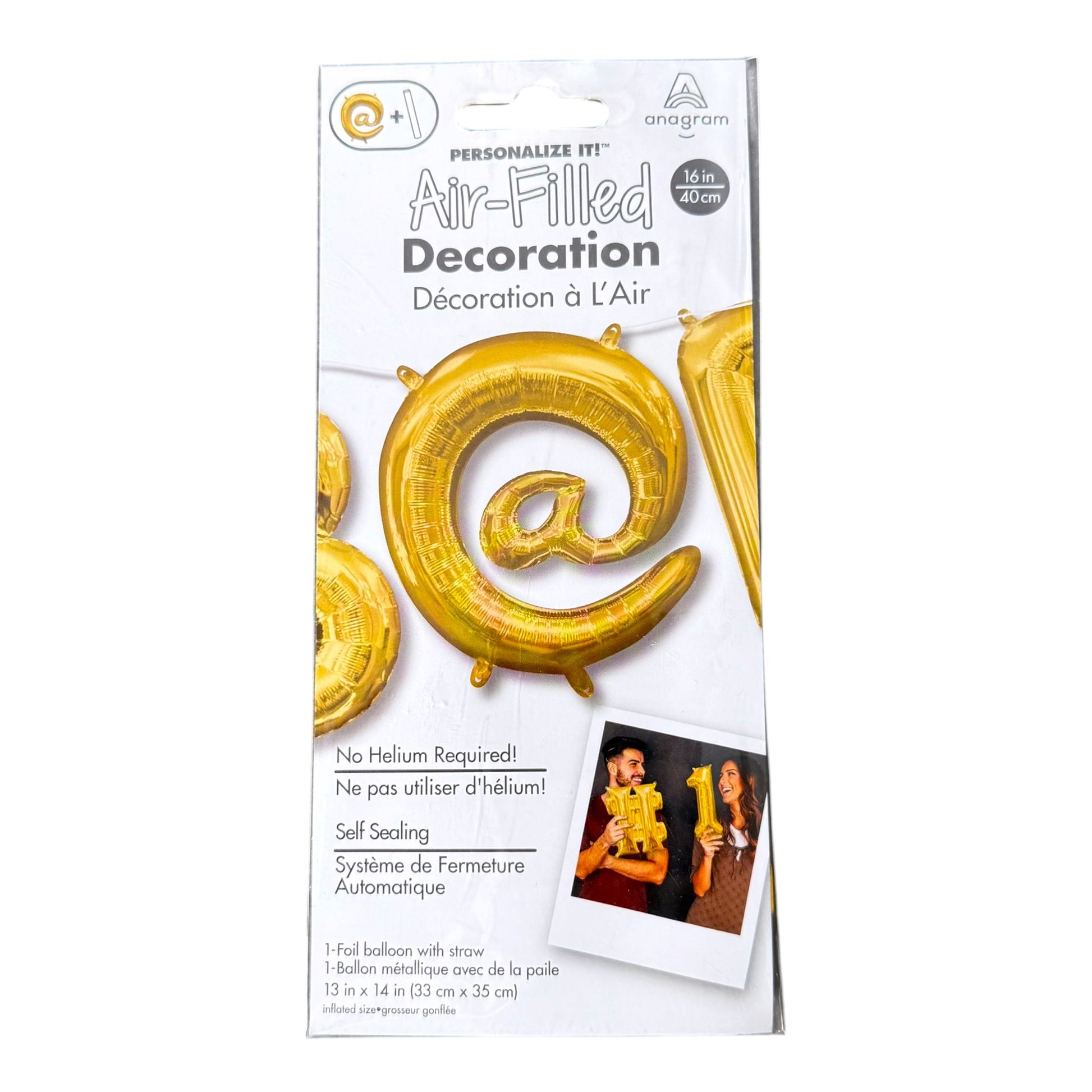 A package of Anagram Air-Filled Decoration spiral '@' shaped gold foil balloon, shown in its white retail packaging with product details and a small photo of the balloons being used.