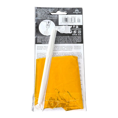 A packaged gold balloon, sealed in clear plastic with a black-and-white retail header card. The header card shows the brand name 'anagram' and product details.