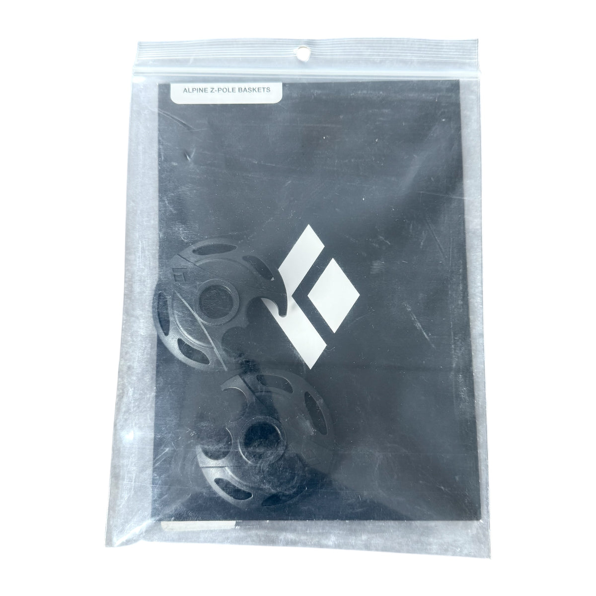A pair of Black Diamond Alpine Pole Baskets in a clear plastic bag on a white background