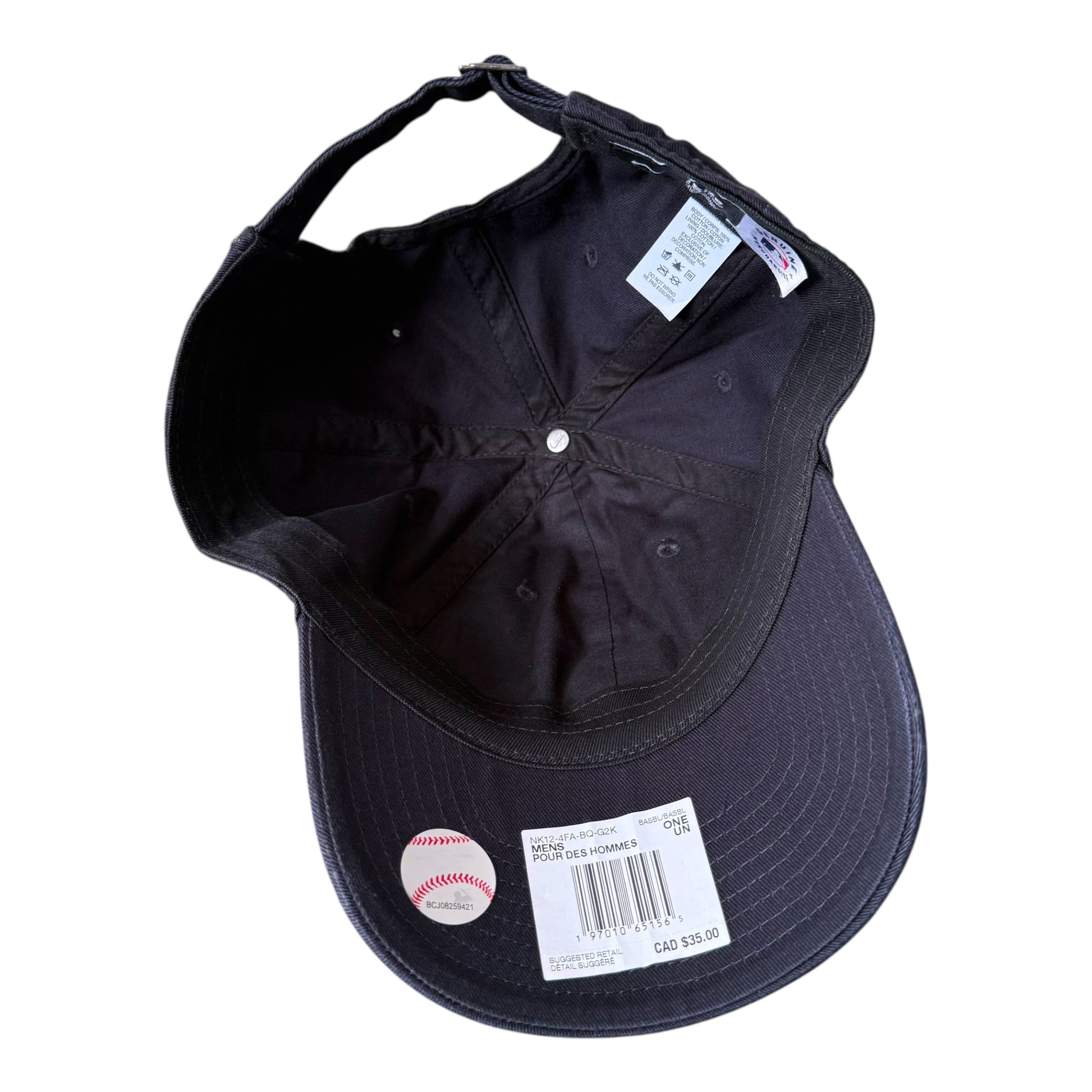 Black baseball cap shown from the underside, featuring a curved brim, a white price tag, a baseball sticker, and interior labels on a plain white background.