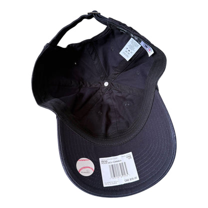 Black baseball cap shown from the underside, featuring a curved brim, a white price tag, a baseball sticker, and interior labels on a plain white background.