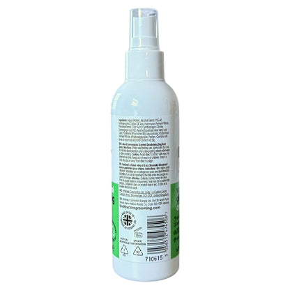 A white plastic spray bottle with a clear spray nozzle, showing the back label with text, a barcode, and green accents on a white background.