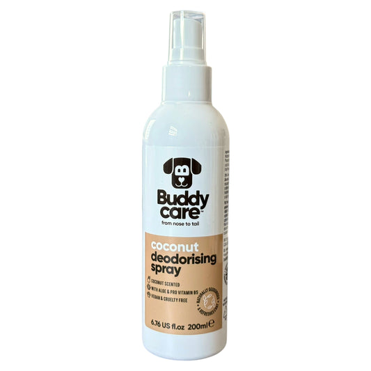 A white plastic spray bottle of Buddy Care Coconut Deodorising Spray with a clear spray top and a beige label, shown against a plain white background.