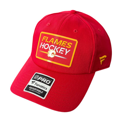 A red structured Calgary Flames baseball cap featuring a yellow and white 'Flames Hockey' patch on the front and a 'Fanatics PRO' sticker on the brim, set against a plain white background.