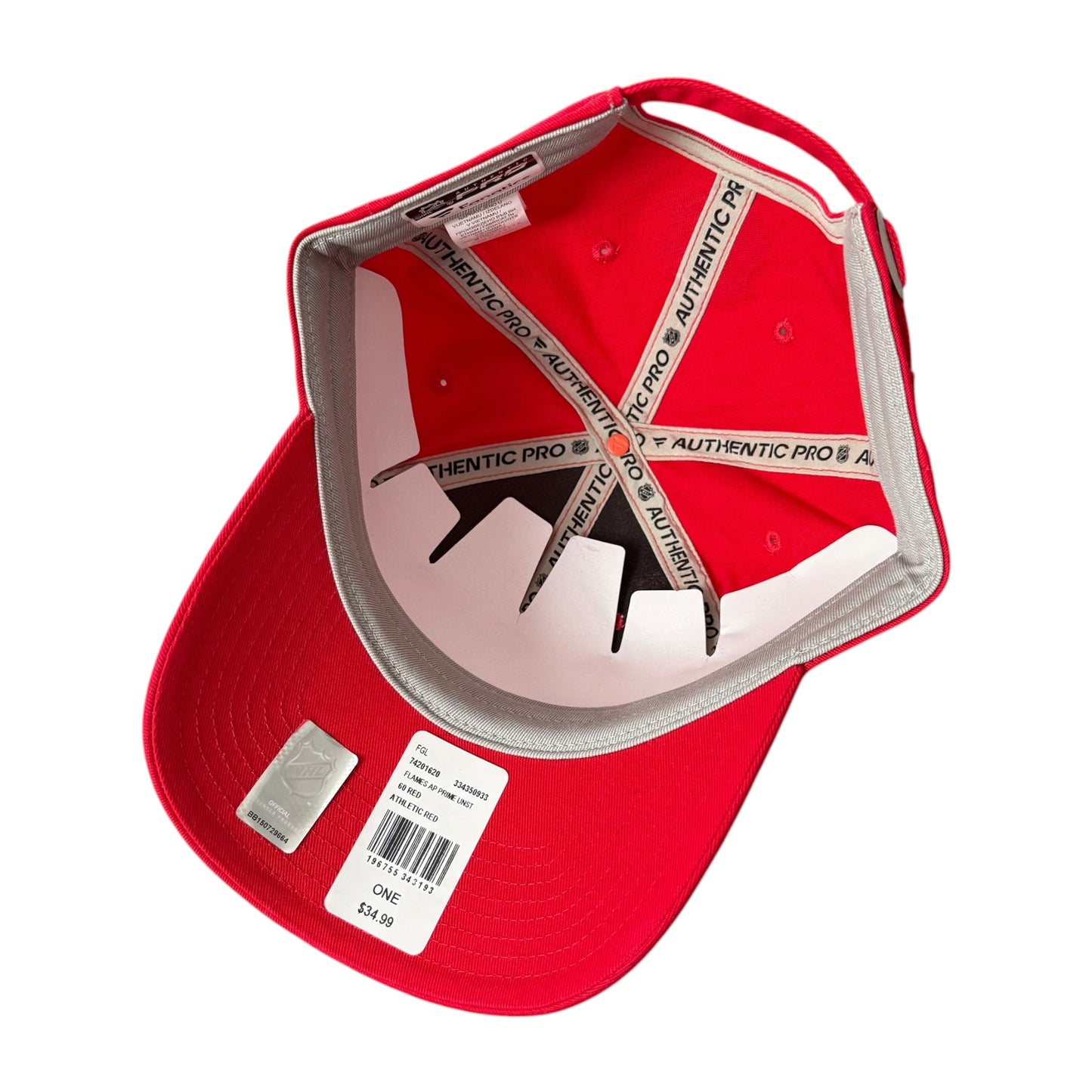 A red Calgary Flames structured baseball cap shown from the inside, featuring a red inner lining and a white size tag attached to the brim.