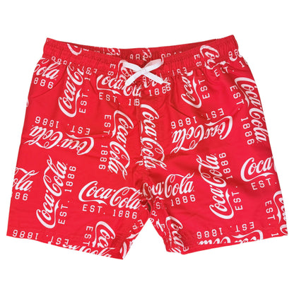 Red Coca-Cola branded swim trunks with an allover white script logo print and a white drawstring at the elastic waistband, shown against a plain white background.