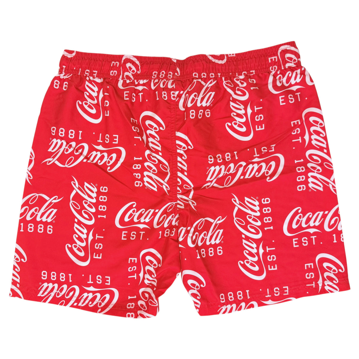 Red swim trunks with an all-over white Coca-Cola logo and script print, shown flat against a white background.