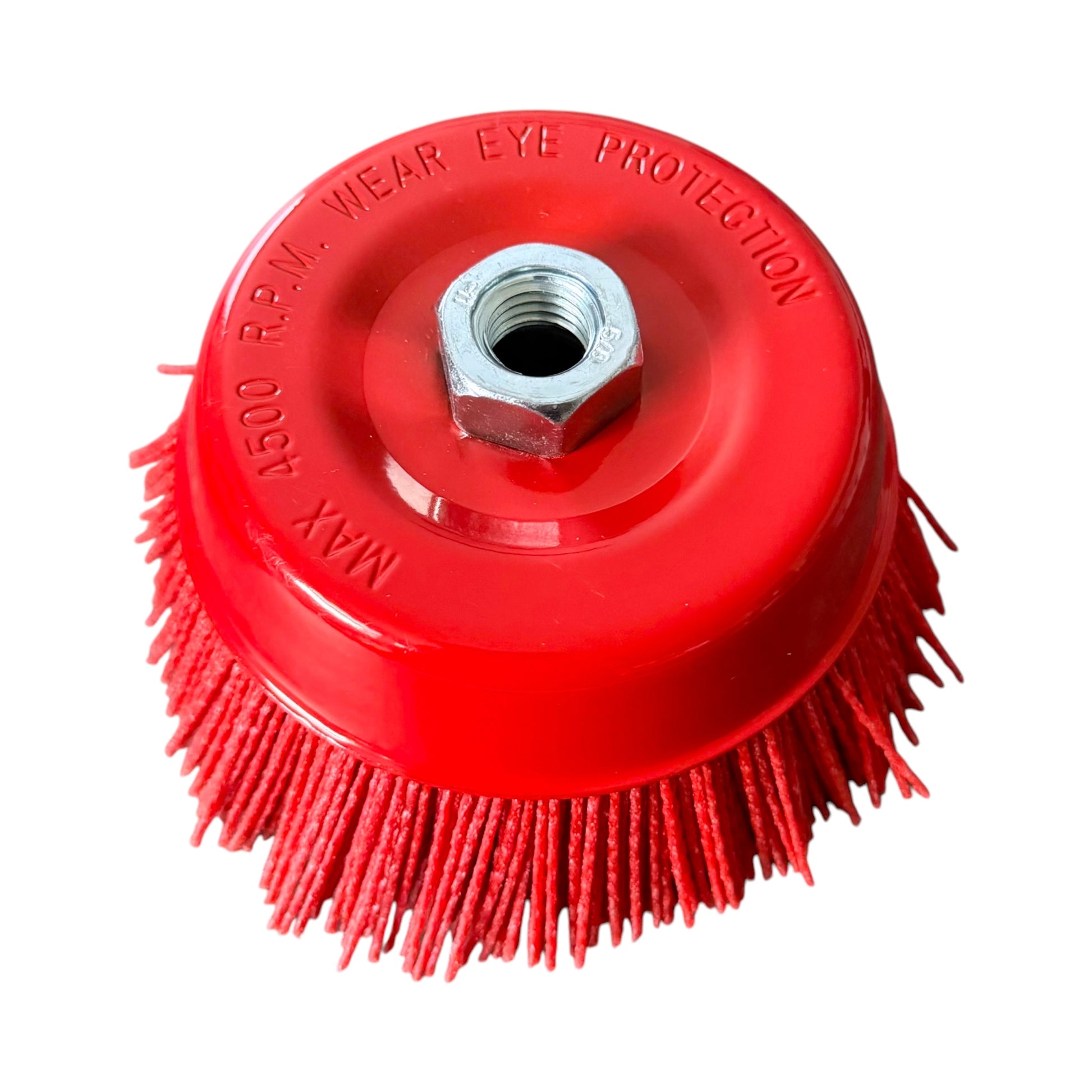 A red circular brush attachment with dense red bristles and a central threaded metal nut, shown on a plain white background. Embossed text on the red top reads 'MAX 4500 RPM WEAR EYE PROTECTION'.