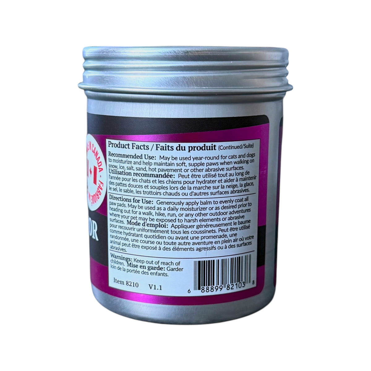 A jar of dr. maggie paw balm with a silver metal screw cap and a dark gray body. The side of the jar features a pink and black label with product facts, a barcode, and a red circular logo that reads 'Made in Canada'.