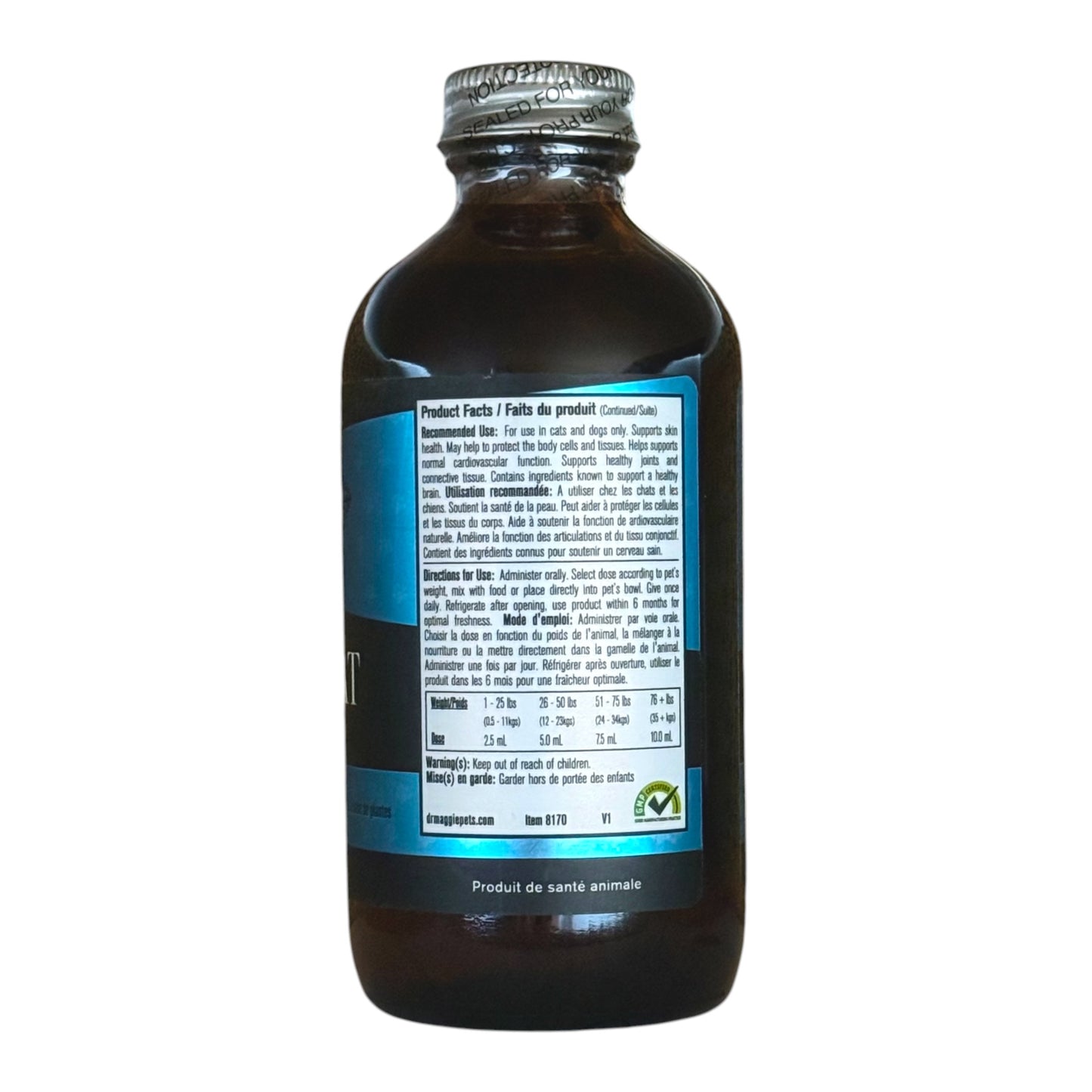 A dark brown glass bottle with a silver metal cap, showing the back of its label which is blue with white text. The brand name 'Dr. Maggie' is visible at the bottom of the label.