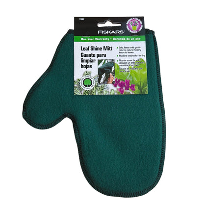 A dark green Fiskars Leaf Shine Mitt gardening glove with its original retail packaging, shown against a plain white background.