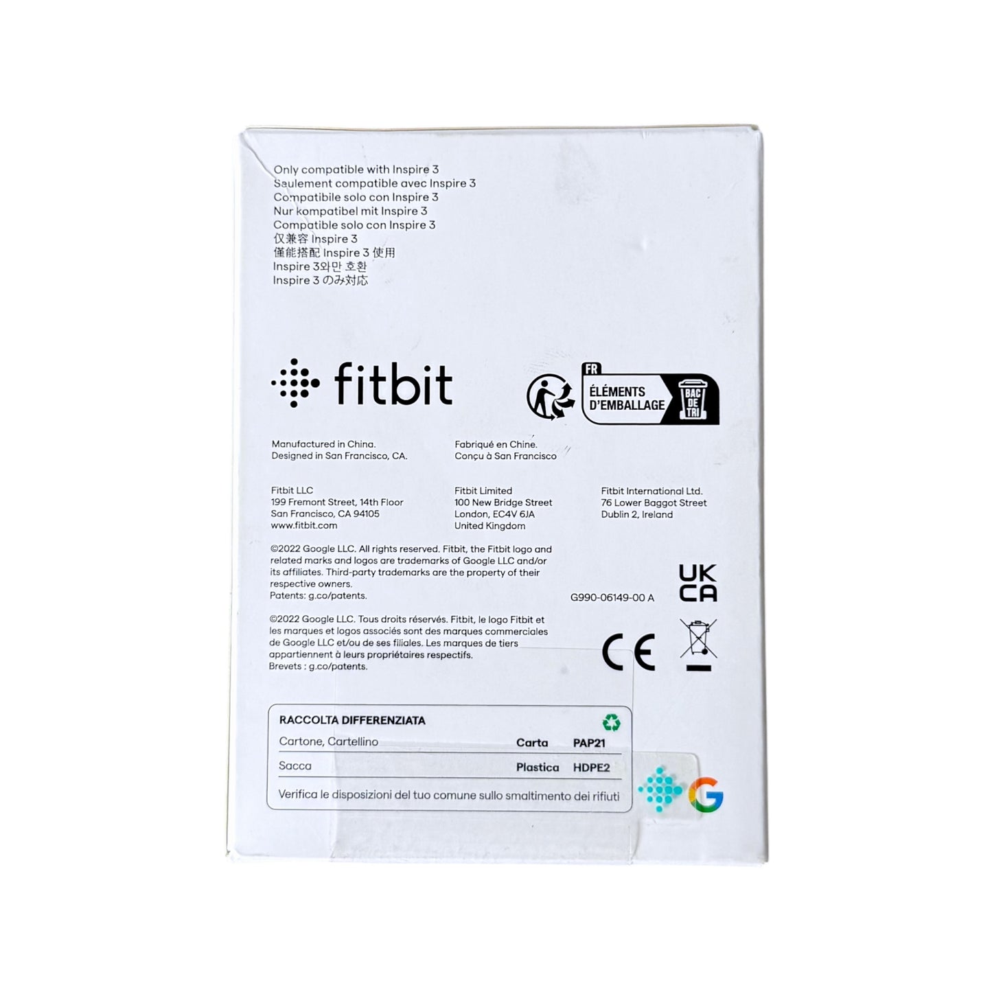 The back of a white Fitbit product box on a plain white background, showing compatibility text, manufacturer details, logos, and regulatory marks.
