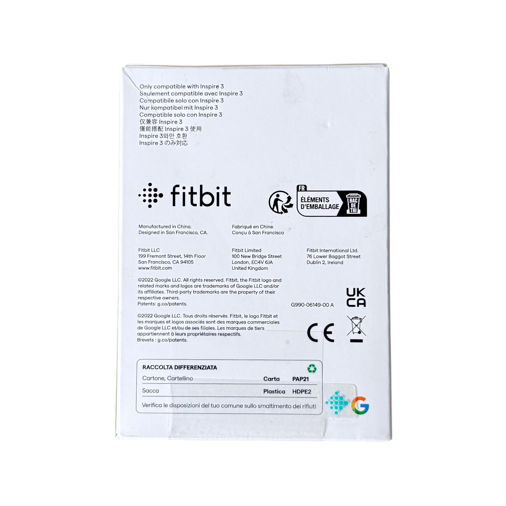 The back of a white Fitbit product box on a plain white background, showing compatibility text, manufacturer details, logos, and regulatory marks.