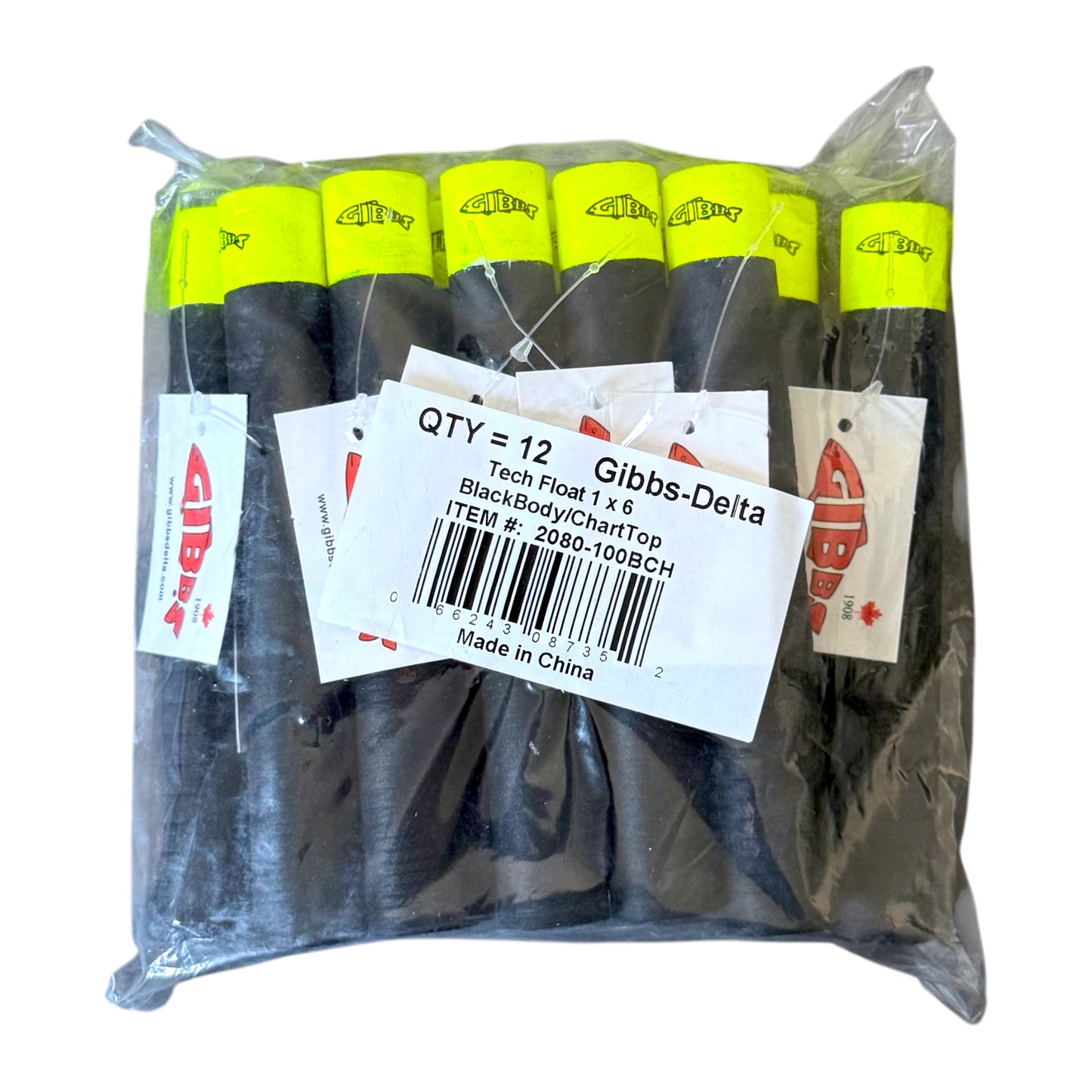 A bulk pack of 12 Gibbs Delta Tech Floats, featuring black bodies and bright neon yellow chart toppers, packaged in a clear plastic bag with a white product label.