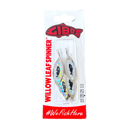 Gibbs Willow Leaf Spinner fishing lure in its original white and red blister card packaging, featuring two silver leaf-shaped lures with holographic iridescent bodies and black fish graphics.