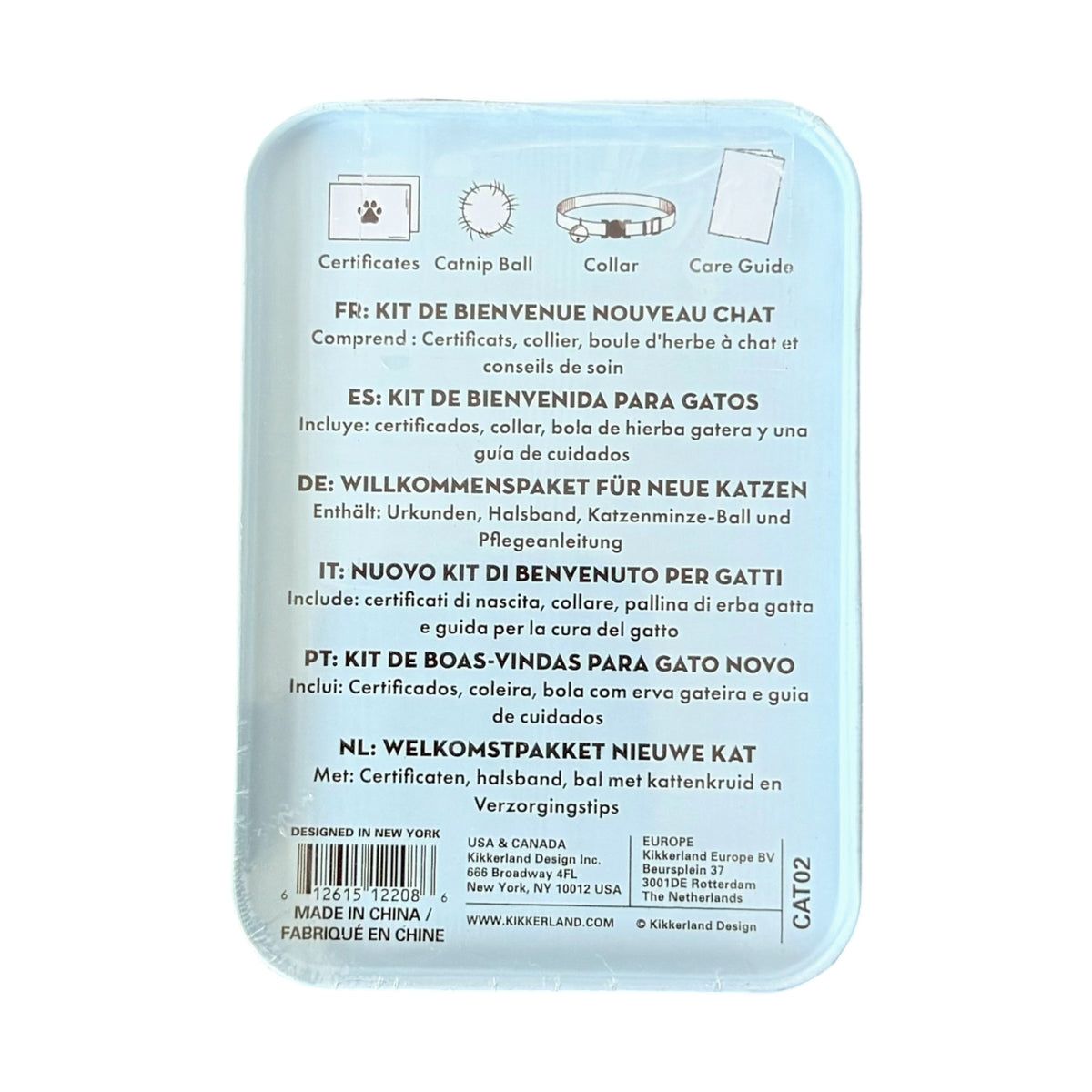 The back of a light blue cat collar gift set tin, featuring multilingual welcome text, product icons for a certificate, catnip ball, collar, and core guide, a barcode, and the Kikkerland brand name.