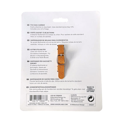 Back side of a white blister card showing product instructions and a small orange-brown poop bag carrier with a clear plastic loop attached, photographed on a white background.