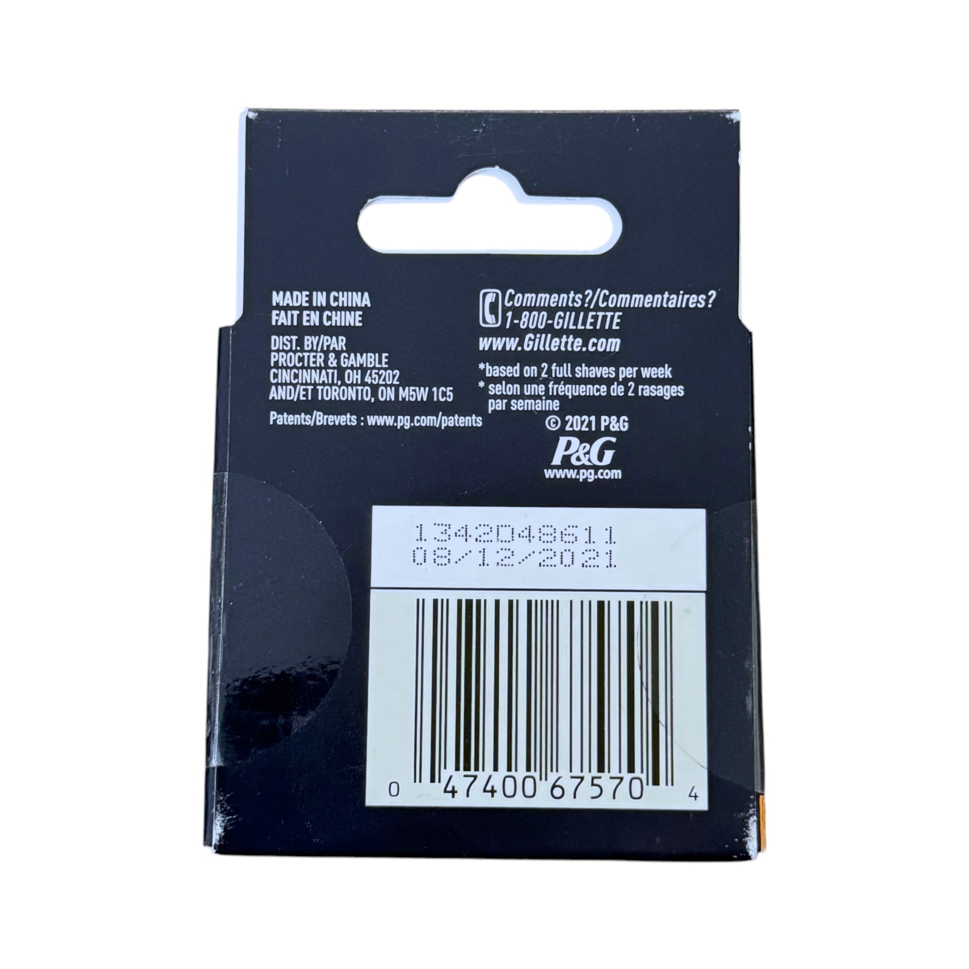 Back of a Gillette packaging with branding, product code, and barcodes on a white background