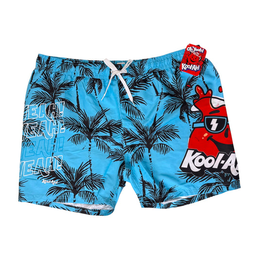 Blue Kool-Aid branded swim trunks with a black palm tree pattern, white drawstring, and red cartoon graphic on the right leg, shown flat on a white background.