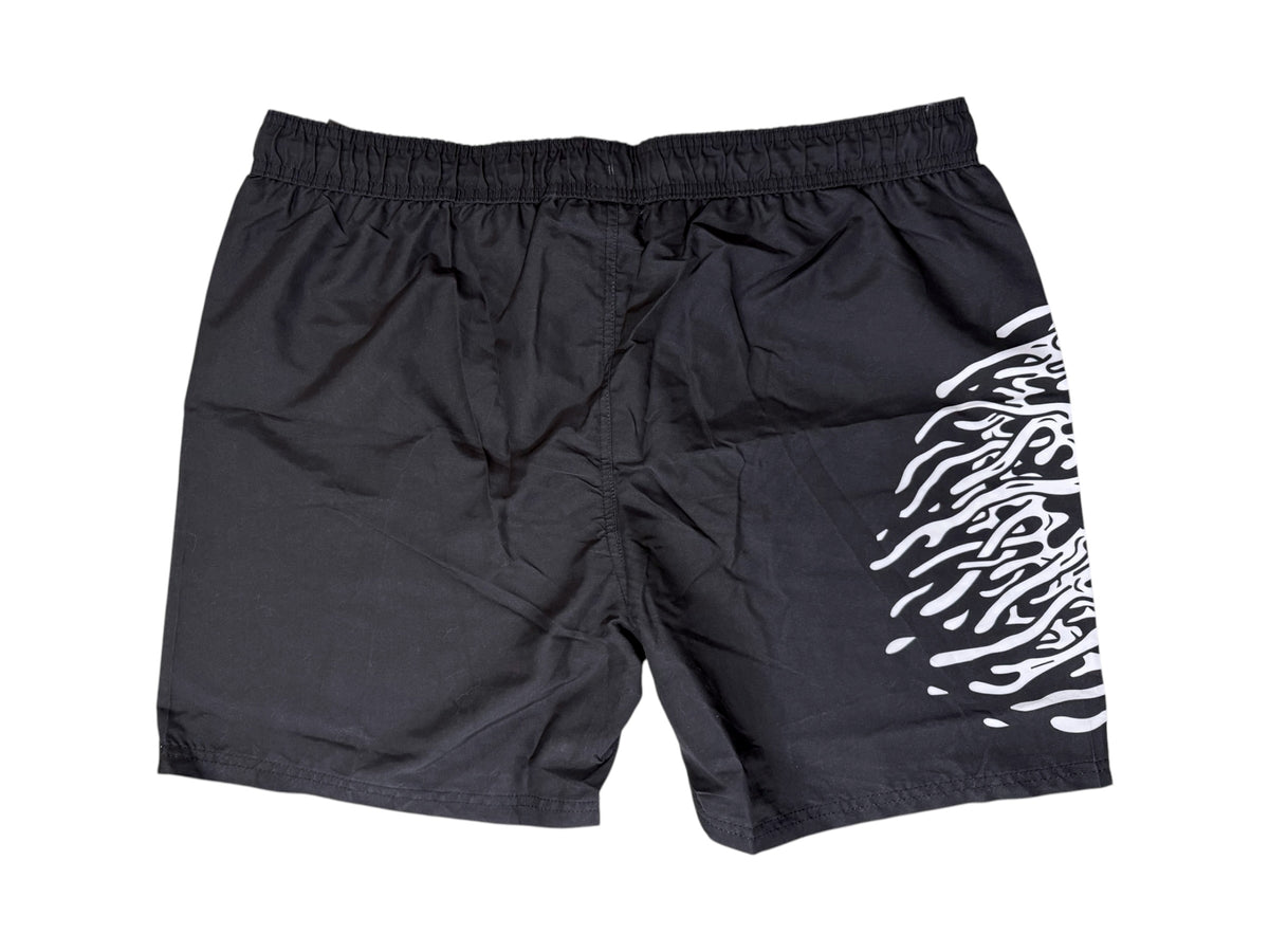 Photo shows a black pair of Liquid Death Men's Swim Shorts with retail tags attached. Shown on a white background.