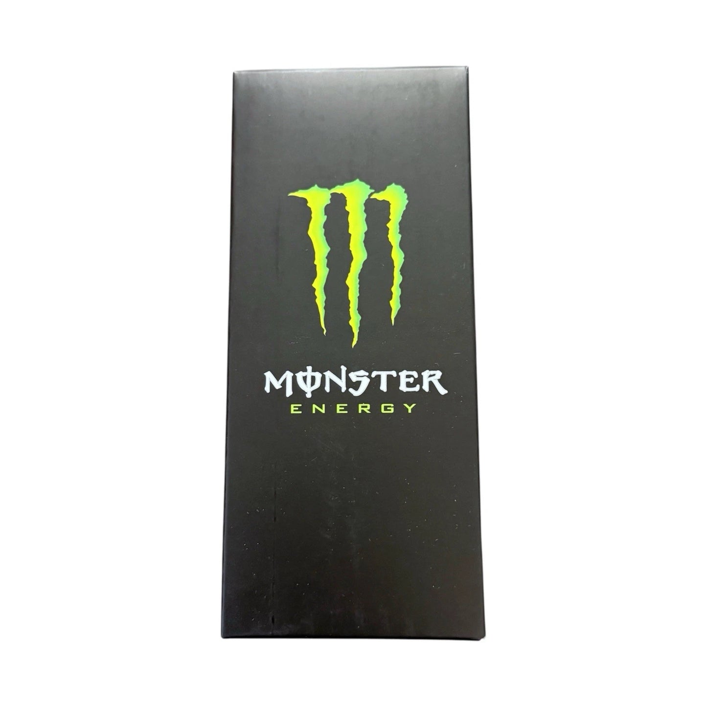 A tall, narrow black box featuring the bright green Monster Energy claw logo and white and green text on the front, centered against a plain white background.