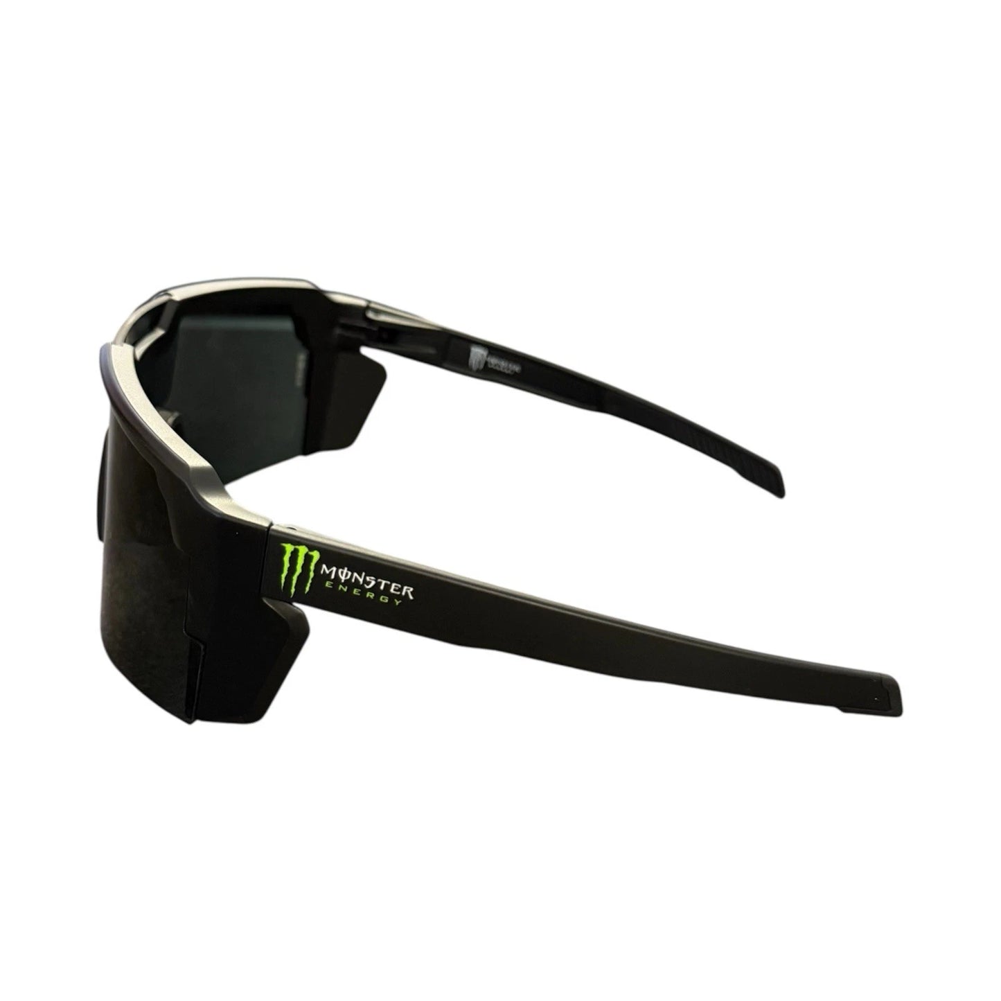 Black wrap-around sunglasses with a Monster Energy logo on the temple, shown against a plain white background.