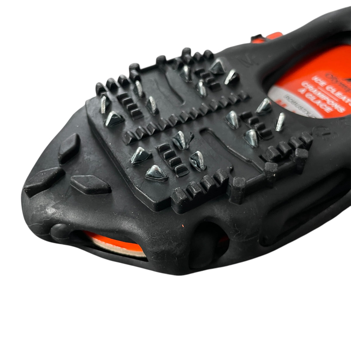 Closeup view of a pair of Olympia black ice cleats with orange branding on a white background
