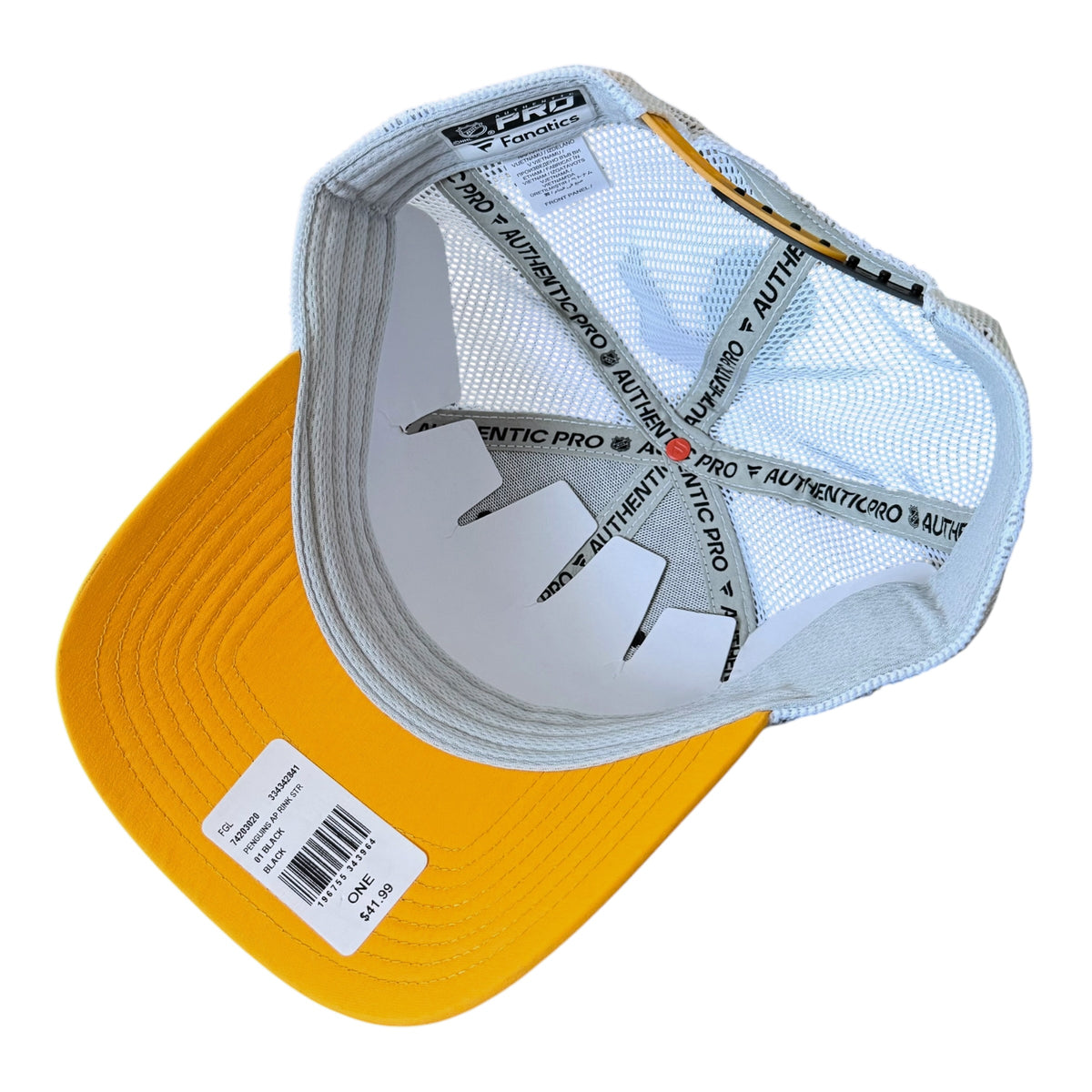 A yellow and white trucker hat shown from the back, displaying the white mesh back, interior branding tape, and a white price tag on the brim.