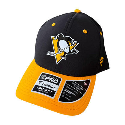 A Pittsburgh Penguins NFL Pro Fanatics Stretch fit baseball cap. The cap features a black crown with the team's penguin logo in yellow, white, and black, and a bright yellow visor and button.
