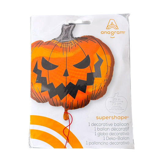 Packaged Anagram Supershape decorative pumpkin balloon, featuring a jack-o'-lantern design in orange and black on a white retail card.