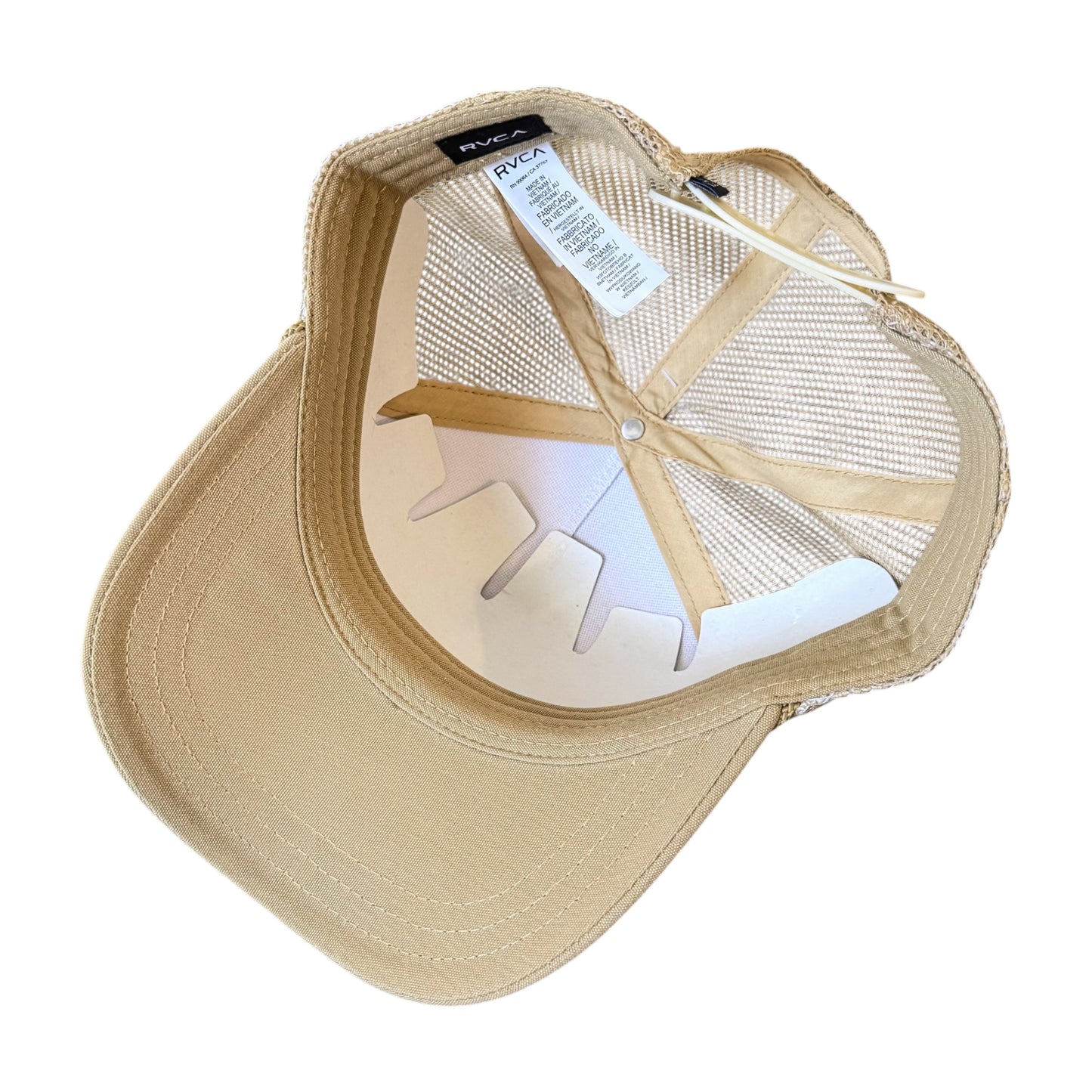 A beige RVCA trucker-style cap shown from the back, featuring a beige fabric visor, beige mesh back panels, and a white plastic interior support insert.