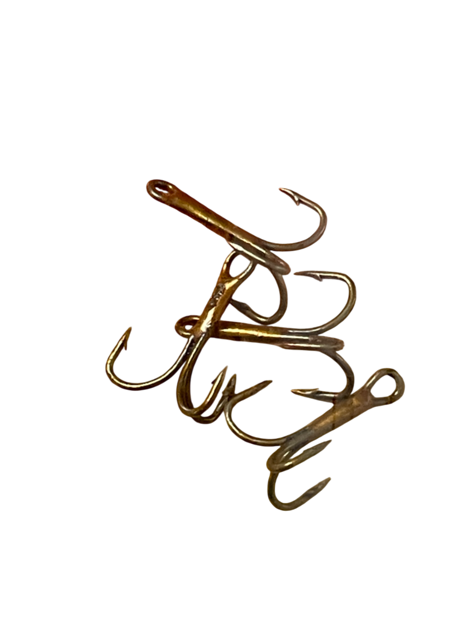 Set of treble fishing hooks on a white background