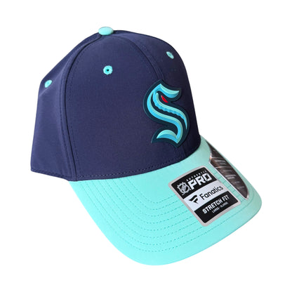 A navy blue and mint green baseball cap with a large stylized 'S' Seattle Kraken logo on the front, featuring a navy crown and a mint green visor. A Fanatics Pro Stretch Fit sticker is visible on the side.