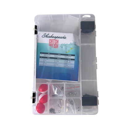 A clear plastic tackle storage case containing fishing accessories, including red and white floats, small bags of hooks and line, and a printed booklet titled 'Shakespeare Catch More Fish'.