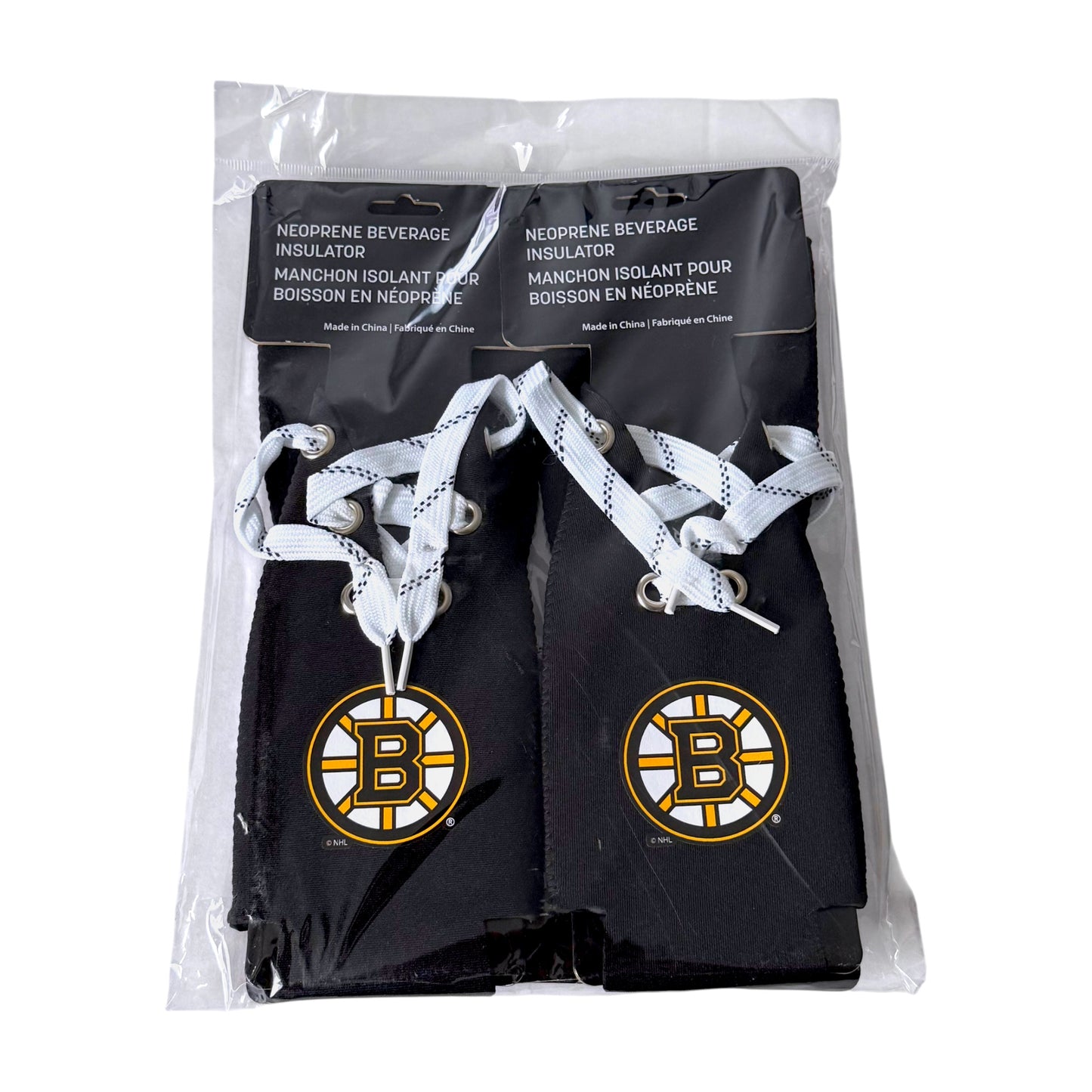 Four pack of black Boston Bruins neoprene beverage insulators in a clear plastic bag with a black header card. Each insulator has white patterned laces and a large Bruins logo on the front.