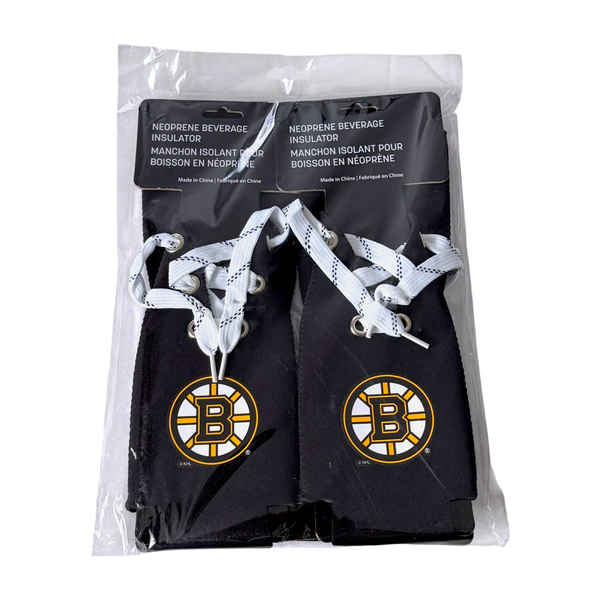 Four pack of black Boston Bruins neoprene beverage insulators in a clear plastic bag with a black header card. Each insulator has white patterned laces and a large Bruins logo on the front.
