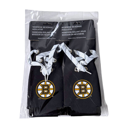 Four pack of black Boston Bruins neoprene beverage insulators in a clear plastic bag with a black header card. Each insulator has white patterned laces and a large Bruins logo on the front.