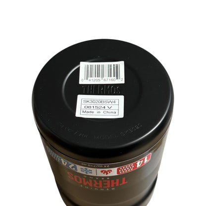 Thermos mug with black lid and visible branding on a white background