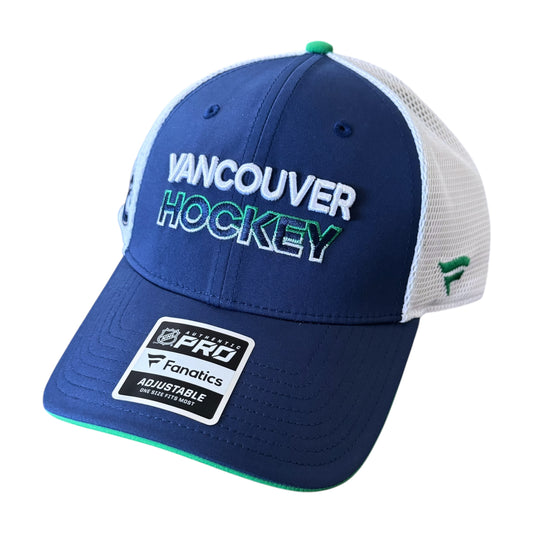 A Vancouver Canucks Hockey Fanatics adjustable trucker hat in navy blue and white mesh, featuring a green and white embroidered logo on the front and a green accent on the brim's underside.