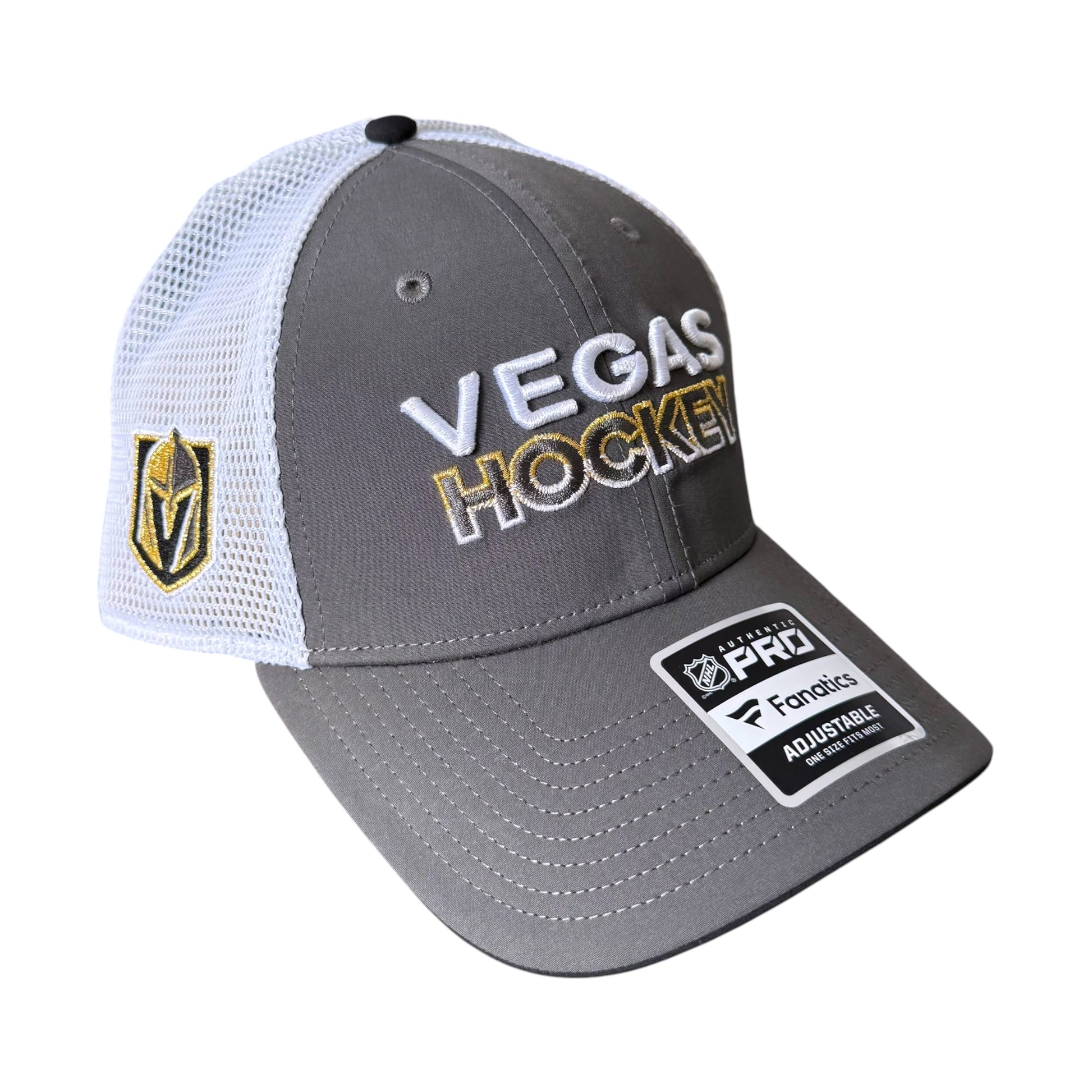A gray and white Fanatics Vegas Golden Knights Hockey trucker hat with a gold and white Vegas shield logo on the side, 'VEGAS HOCKEY' embroidered on the front, and a Pro Factory adjustable strap patch on the brim.