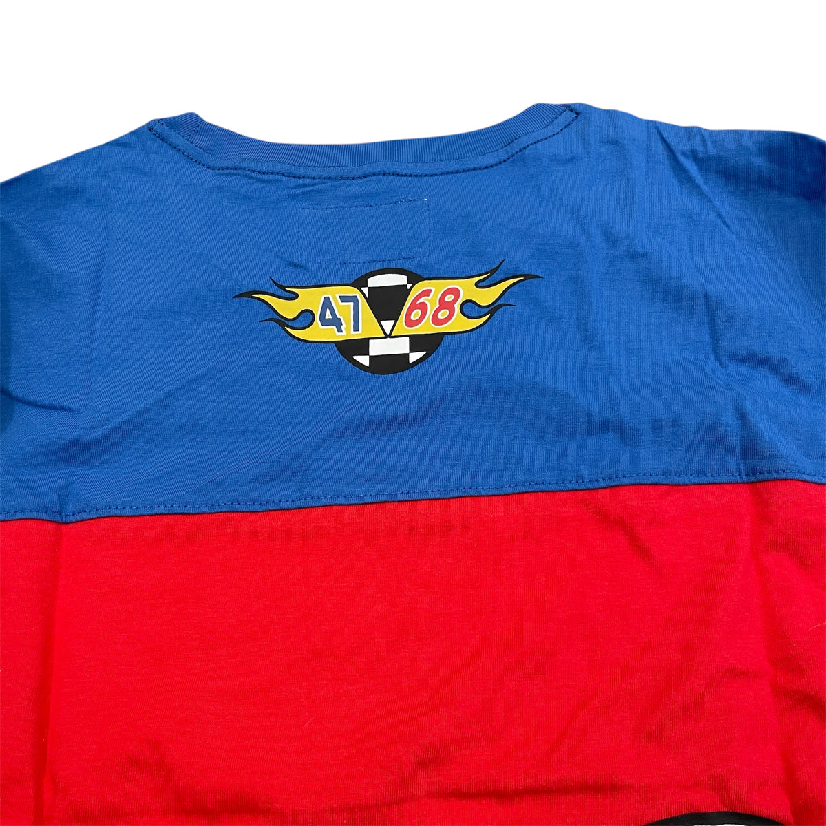 A long-sleeve men's shirt with color blocks in blue, white, and red, featuring the Wrangler and Hot Wheels brands.