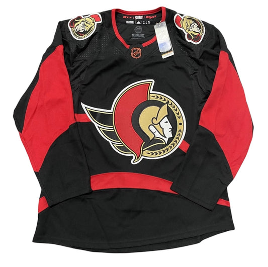 Front of adidas Ottawa Senators Reverse Retro jersey, size 50, in black and red with Senators crest and shoulder patches
