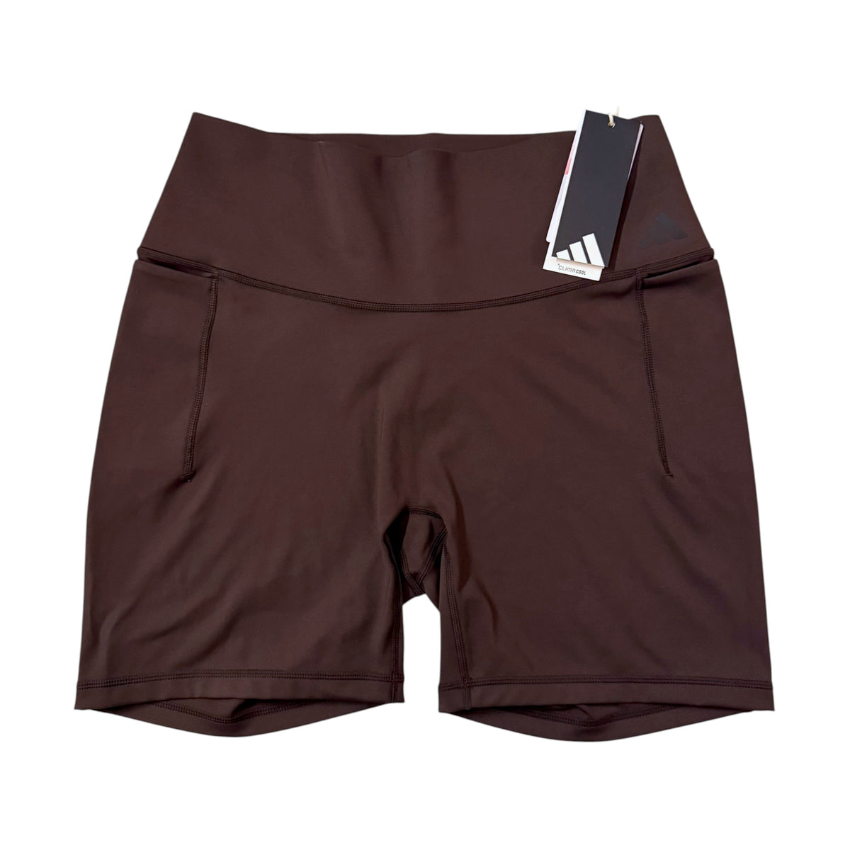 Front view of adidas women's brown 6-inch fitted shorts KB0462 with wide waistband and CLIMACOOL hangtag