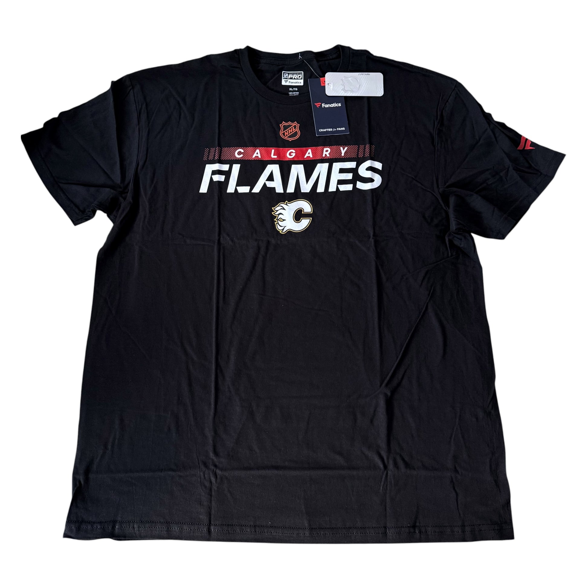 A black Calgary Flames t-shirt with 'CALGARY FLAMES' printed in white and red across the chest, featuring the team logo below. The shirt is shown flat with retail tags attached against a white background.