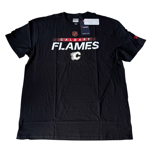 A black Calgary Flames t-shirt with 'CALGARY FLAMES' printed in white and red across the chest, featuring the team logo below. The shirt is shown flat with retail tags attached against a white background.