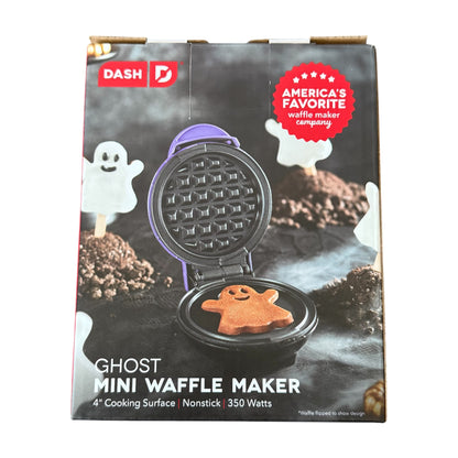 Ghost mini waffle maker with packaging featuring Dash brand logo and Halloween-themed graphics.